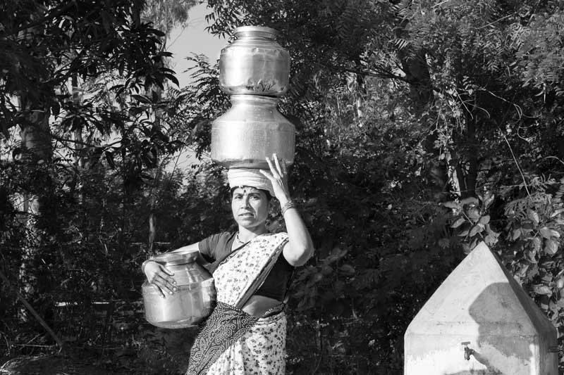 Water portraits - A middle-aged rural lady making several trips everyday for procuring water in the absence of a water source at home – Ahmednagar district, Maharashtra